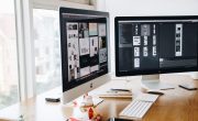 Silver Imac on Top of Brown Wooden Table