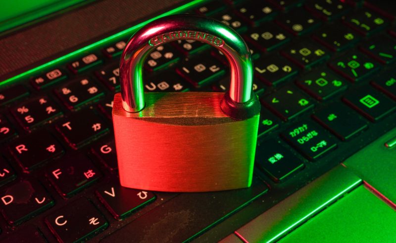 red padlock on black computer keyboard