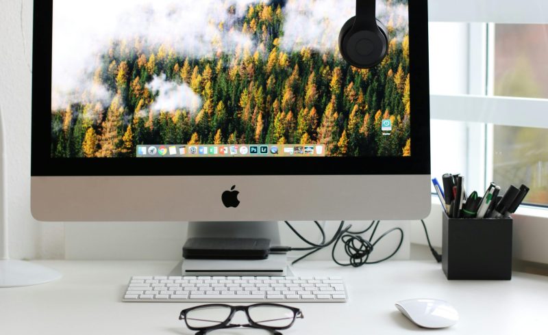 Free Stylish home office workspace featuring a computer setup with accessories. Stock Photo